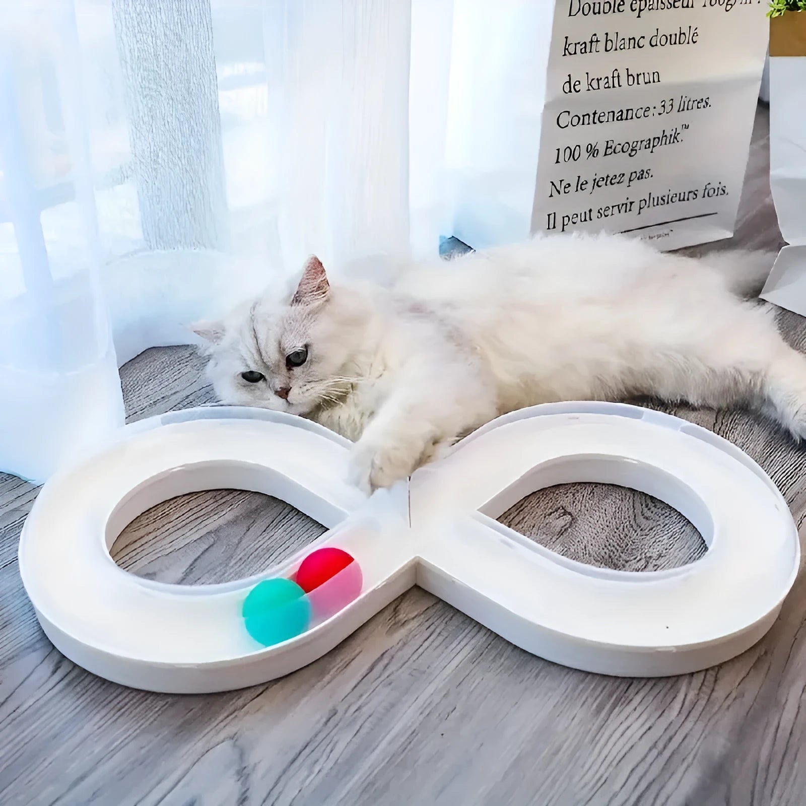 Multipack of four cat toys including a blue turntable track, a ball, and a teasing stick.