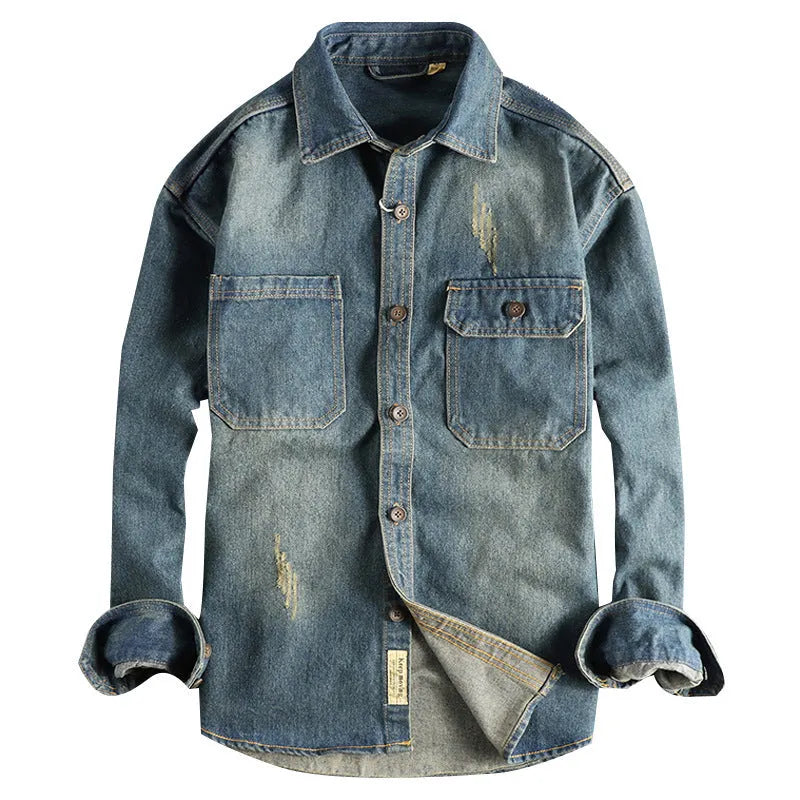 Men's light blue loose-fit vintage denim shirt with long sleeves on a hanger.