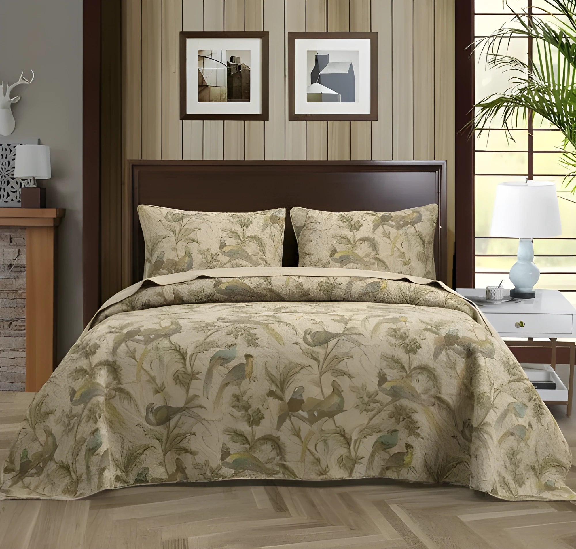 American-style floral quilted cotton bedspread in blue, shown draped on a double bed.