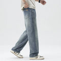 Retro straight-leg jeans for men in light blue cotton denim on a neutral background.