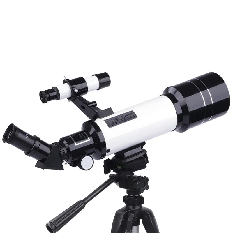 Dark blue and white children's astronomical monocular telescope on a tripod with a mobile phone holder attached.