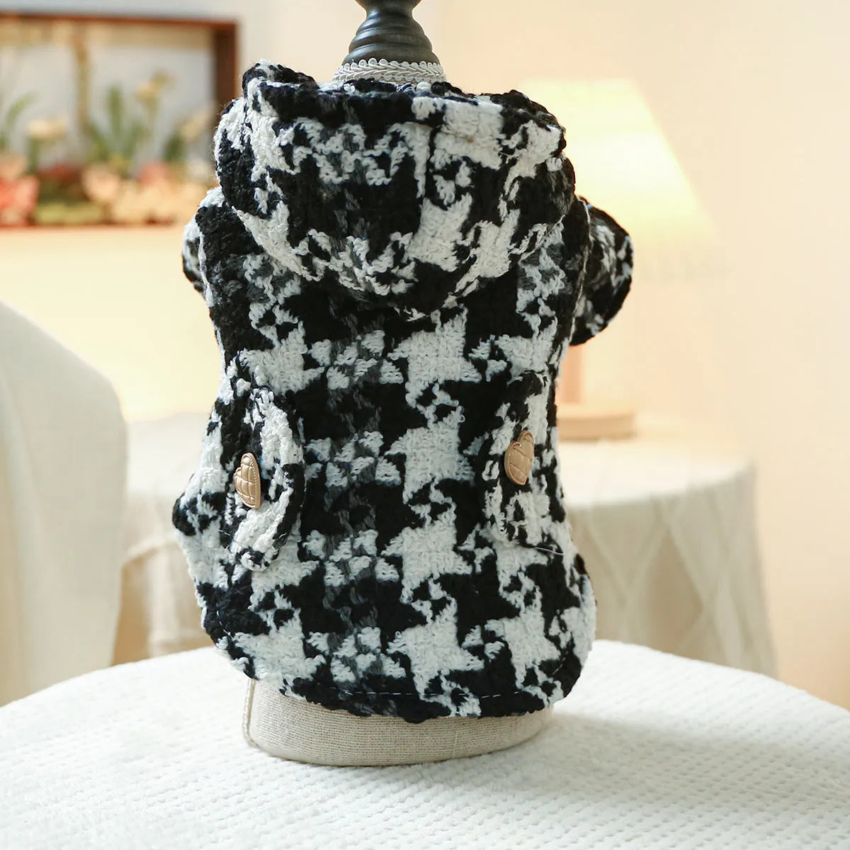 Red plaid dog trench coat on a medium-sized dog, showing the structured collar and classic trench design for winter.