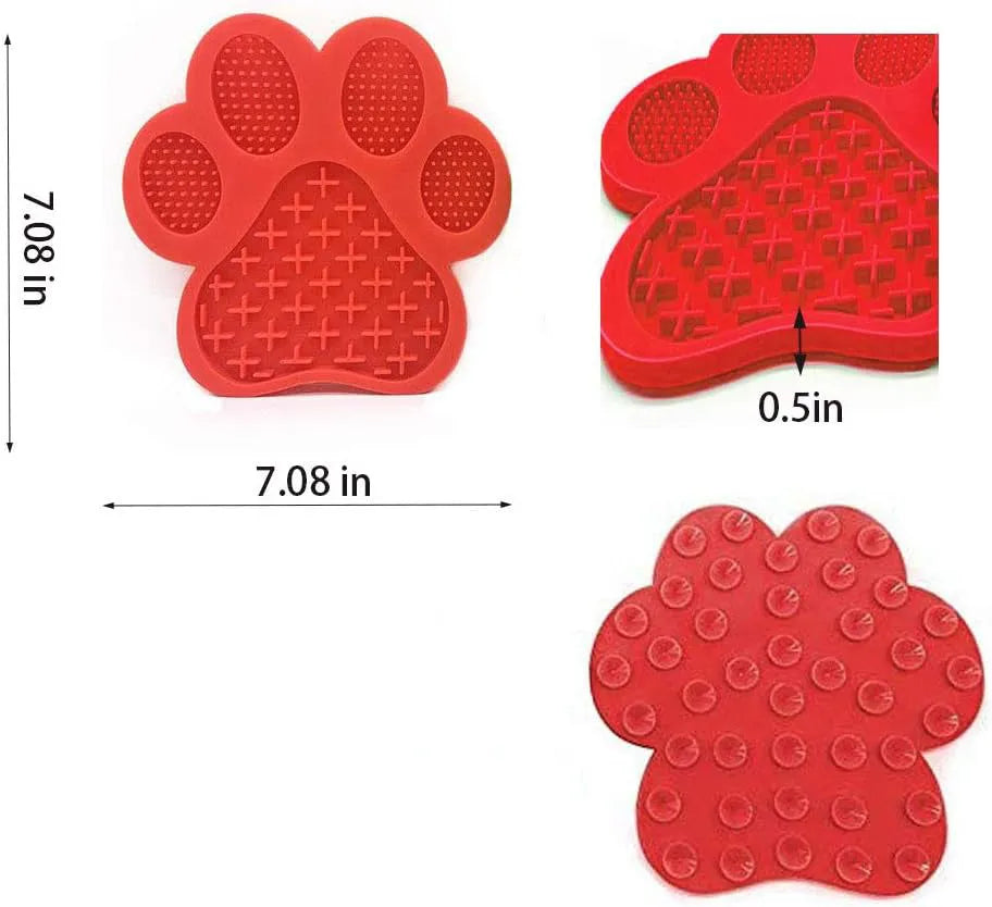 Blue bone-shaped silicone dog licking mat with suction cups on a tiled shower wall.