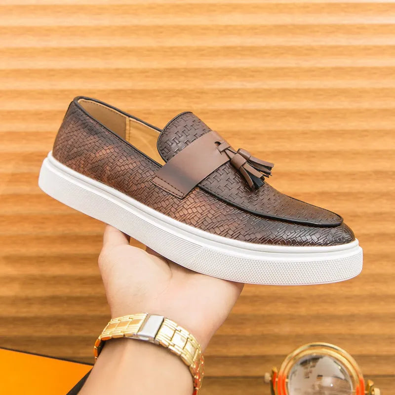 Men's black casual leather shoes with fringe detailing on the upper, round toe, and low heel.