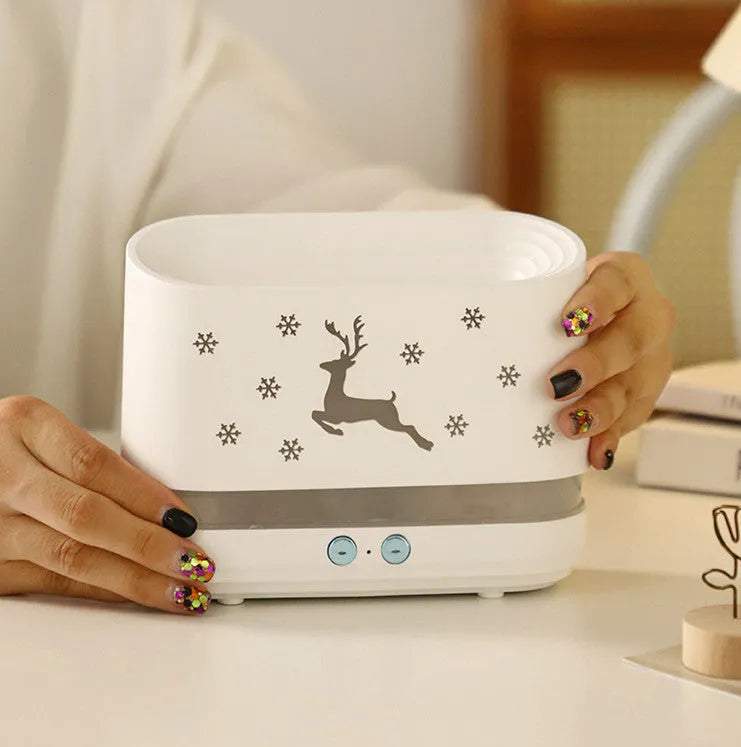 White round Elk flame effect humidifier diffuser with night light on a table.