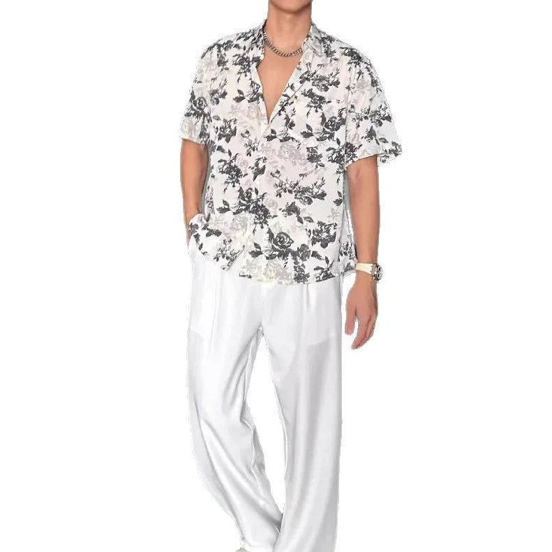 Loose fit short sleeve floral print shirt in white, shown on a hanger.