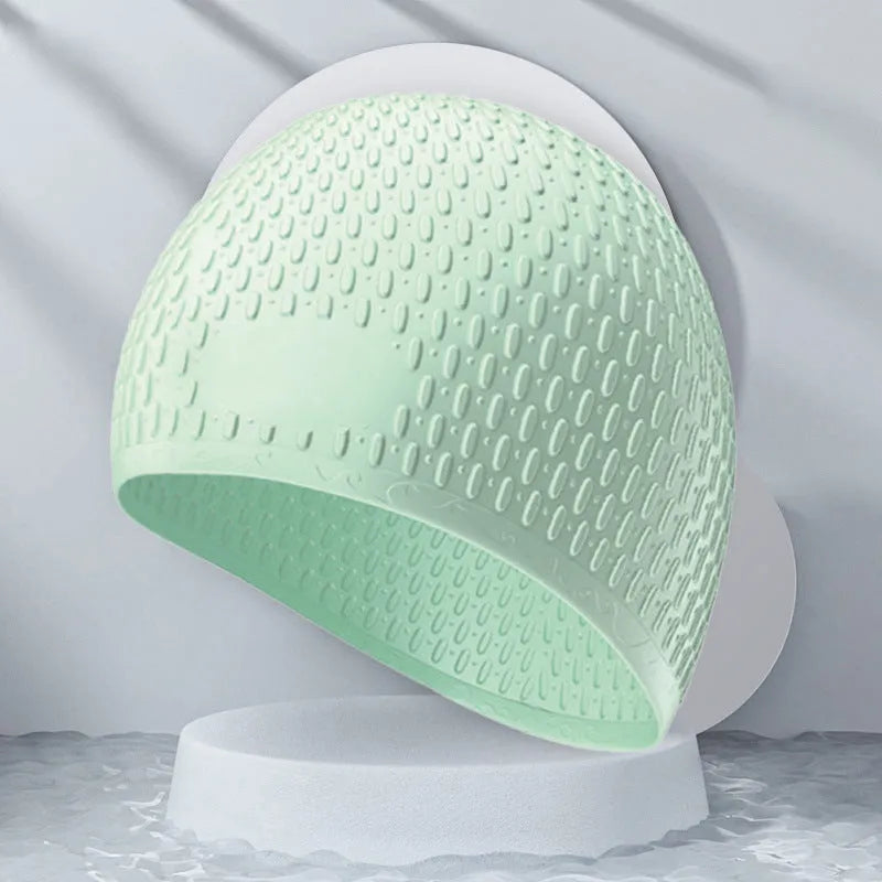 Solid colour silicone swimming cap for adults, shown in one of eight available colours including Tiffany Blue.