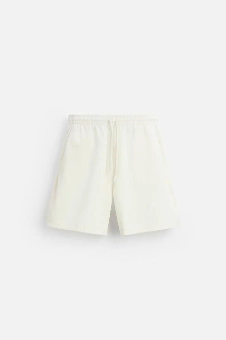 Loose double-sided cloth texture short sleeve shirt and matching shorts casual set on a hanger.