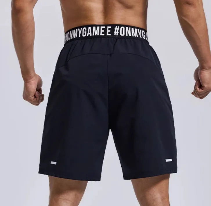 Men's loose fit sports shorts in breathable fabric with elastic fly opening