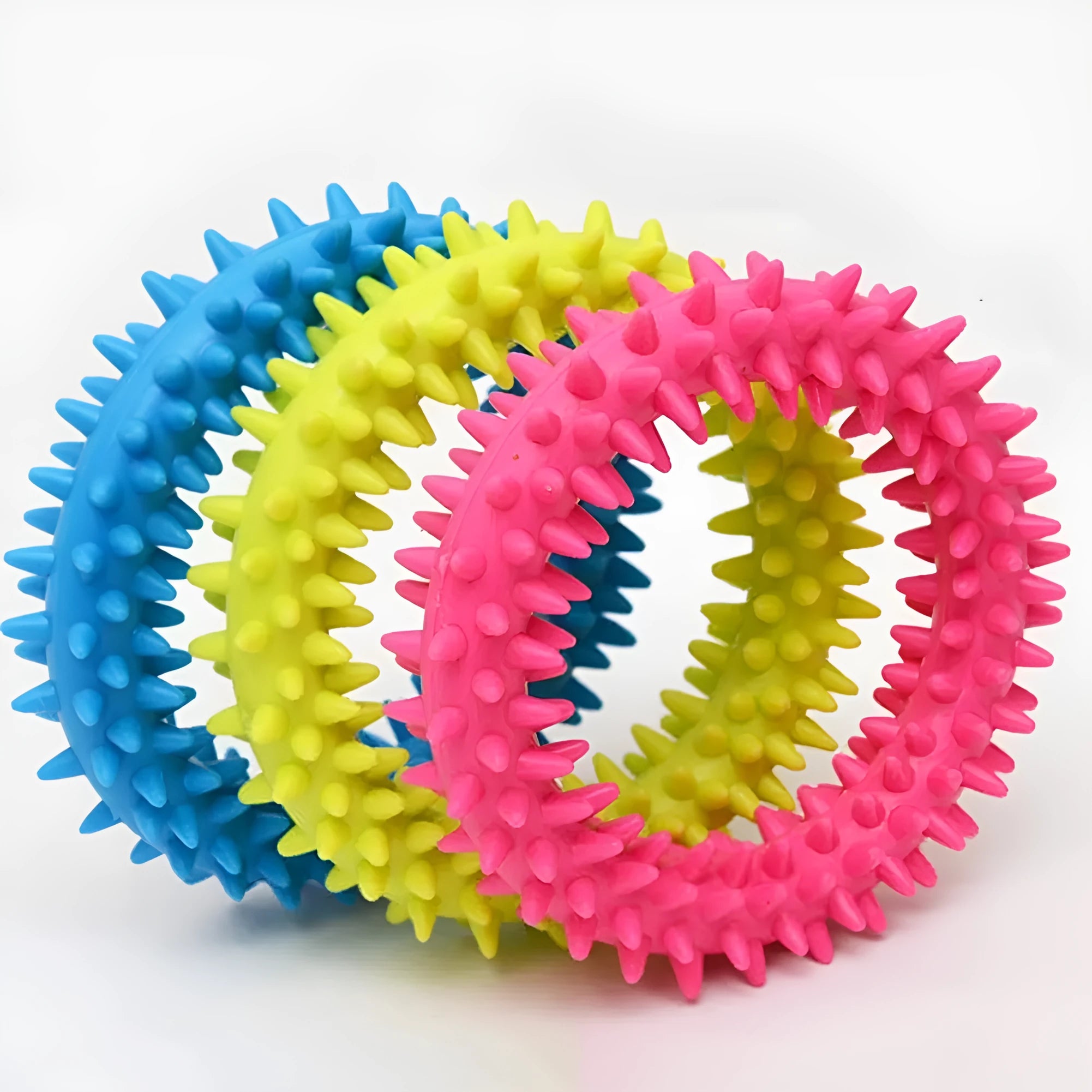 Blue TPR spiky circle ring dog chew toy for teeth cleaning on a white background.