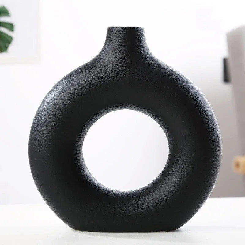 A simple modern frosted porcelain biscuit vase for flower arranging, shown in a neutral colour.