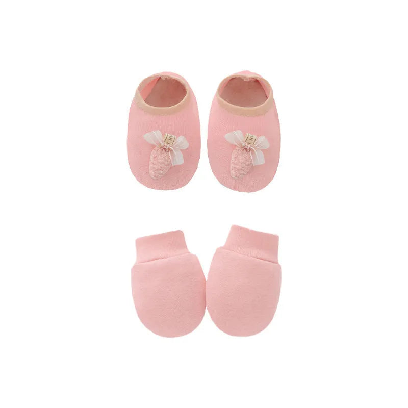 Set of white, light blue, and grey cotton baby pullover caps, gloves, and foot covers for infants.