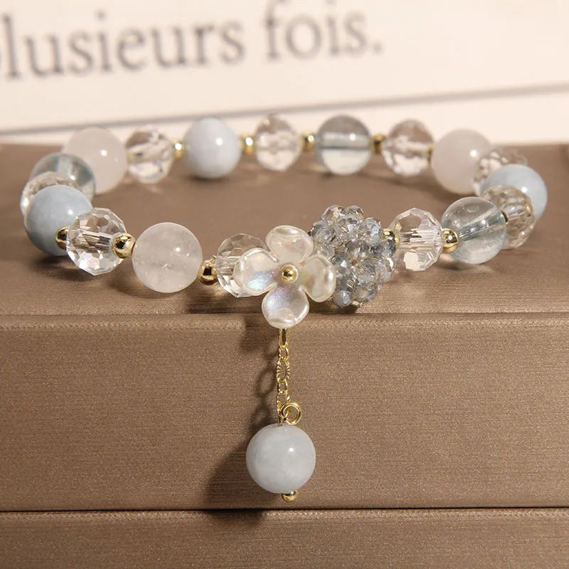Woven aquamarine crystal bracelet with opal floral elements and cat motifs