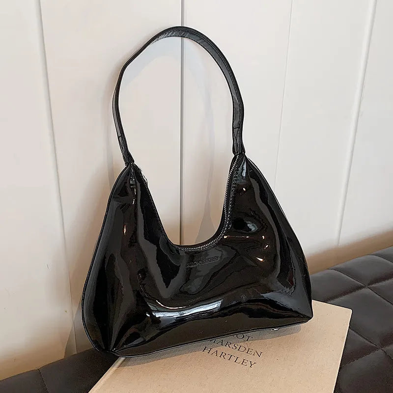 High Sense French PU shoulder bag in dumpling shape with sewing line detail and sandwich pockets