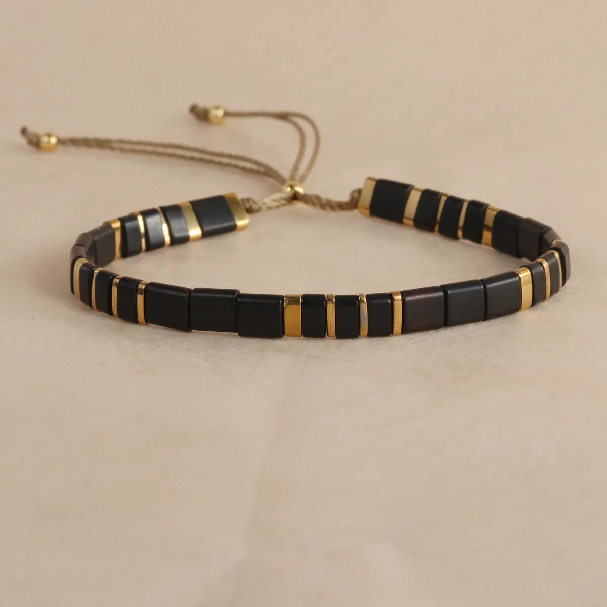 Geometric beaded bracelet with round glass and coloured glaze beads in five colour options.