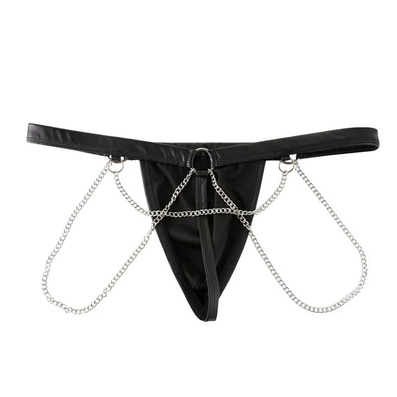 Men's black patent leather thong shorts with a metallic chain detail on the front.