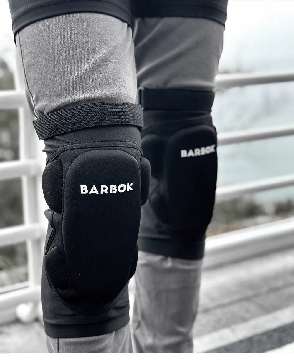 Black adult skating hip protection pad made of spandex and NBR foam on a grey background.