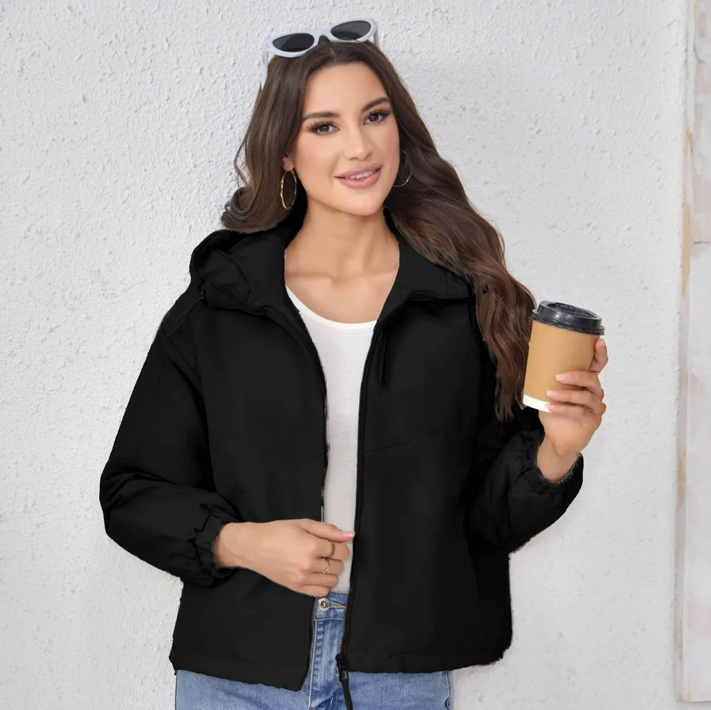 Women's grey loose-fit hooded polyester jacket with full zip and long sleeves.