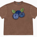 Loose fit blueberry and fruit patchwork print short sleeve T-shirt on hanger