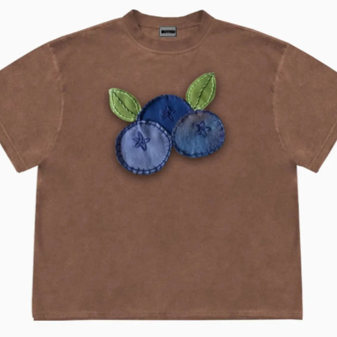 Loose fit blueberry and fruit patchwork print short sleeve T-shirt on hanger