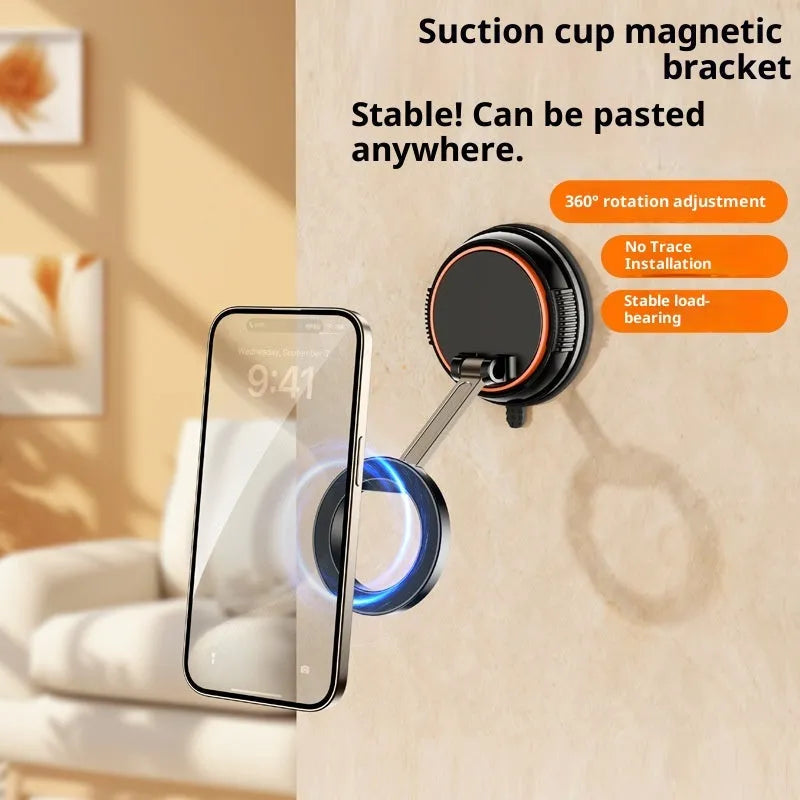 Foldable metal magnetic car phone holder in black and orange on a dashboard