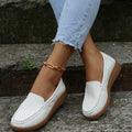 Women's black PU leather flat shoes with round toe and rubber sole on a white background.