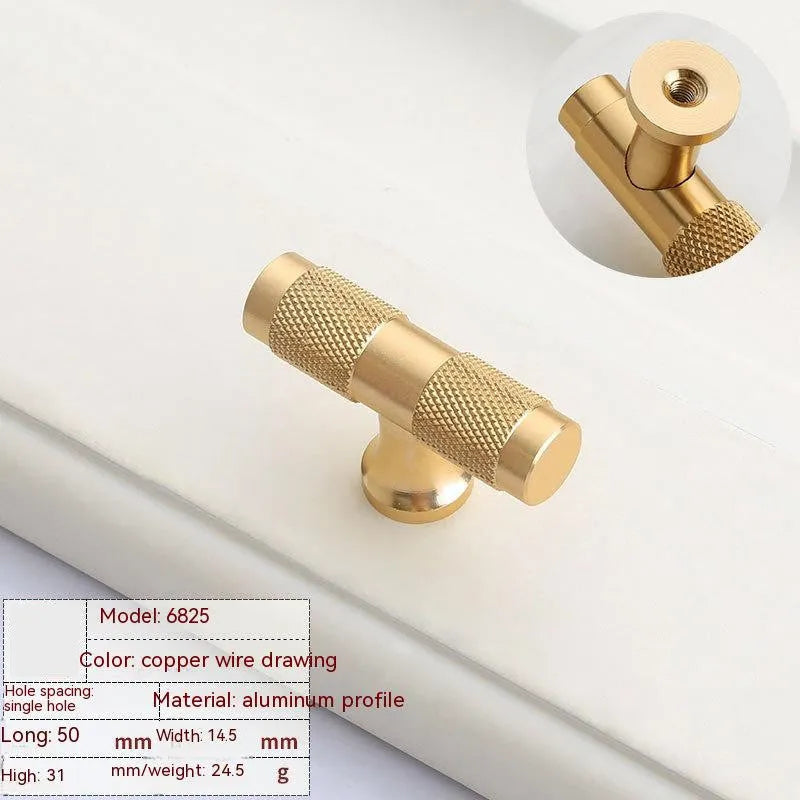 Brushed brass aluminium wardrobe handle with visible mounting holes for cabinet furniture.
