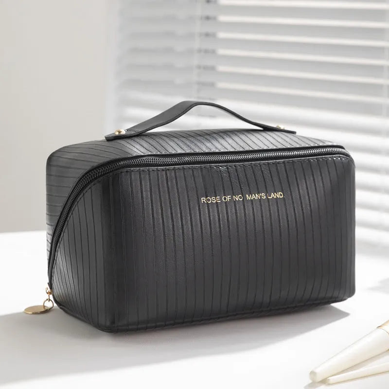 Large beige cubic PU leather makeup bag with vertical pattern, shown open.