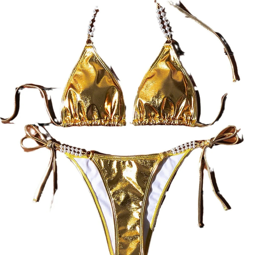 Gold halter neck bikini with lace-up front and pearl chain decoration