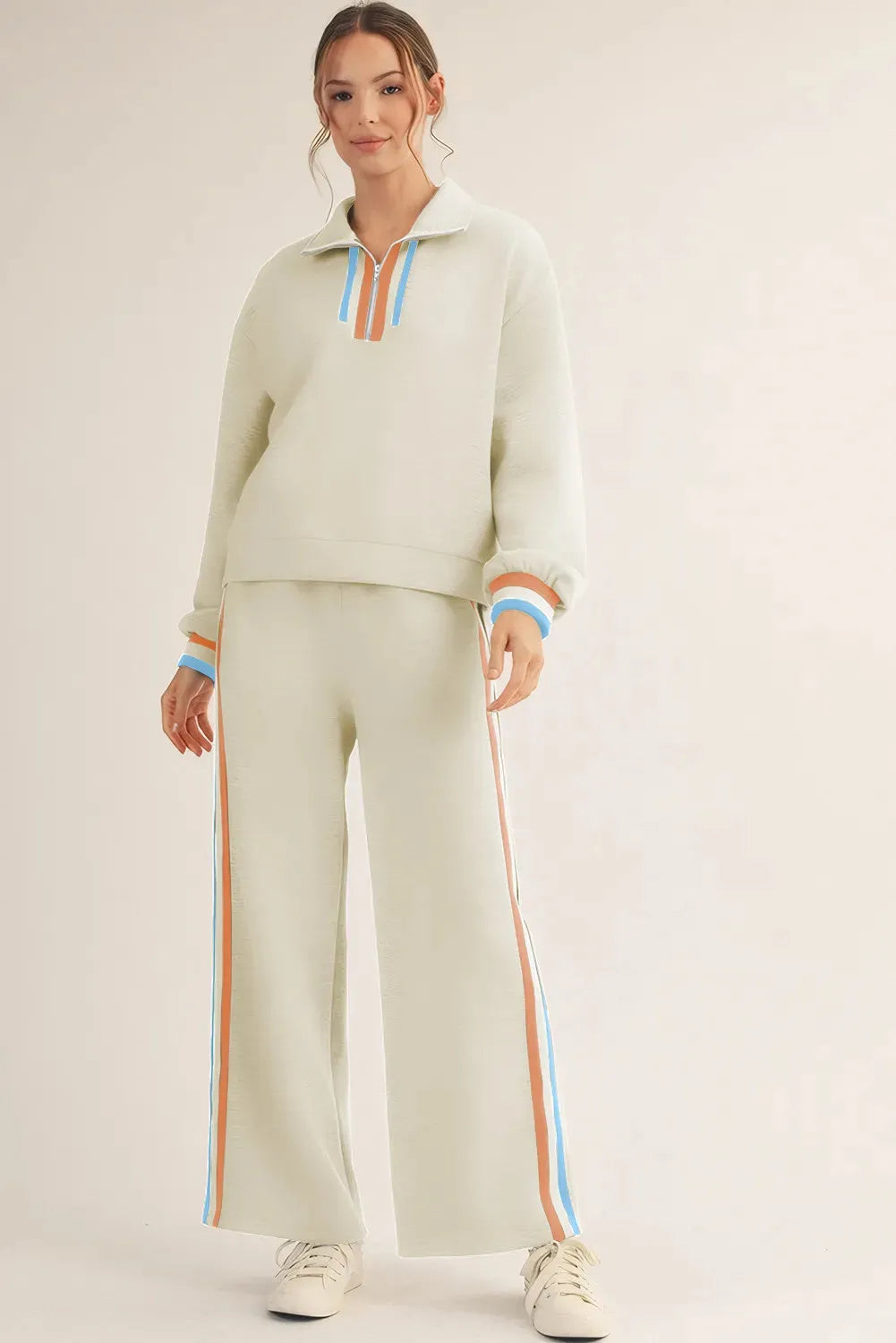 Apricot striped patchwork quarter zip pullover and loose pant set on model, women's two-piece loungewear