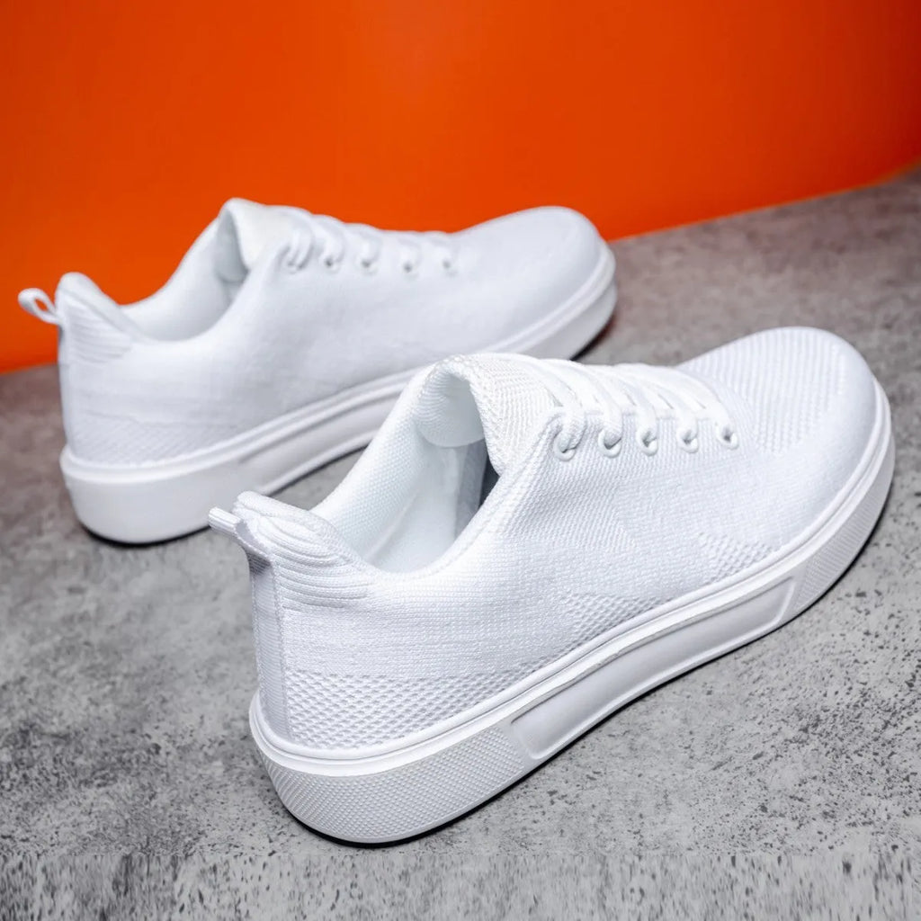 Light white unisex trainers with thick EVA sole and mesh upper in black or white colours