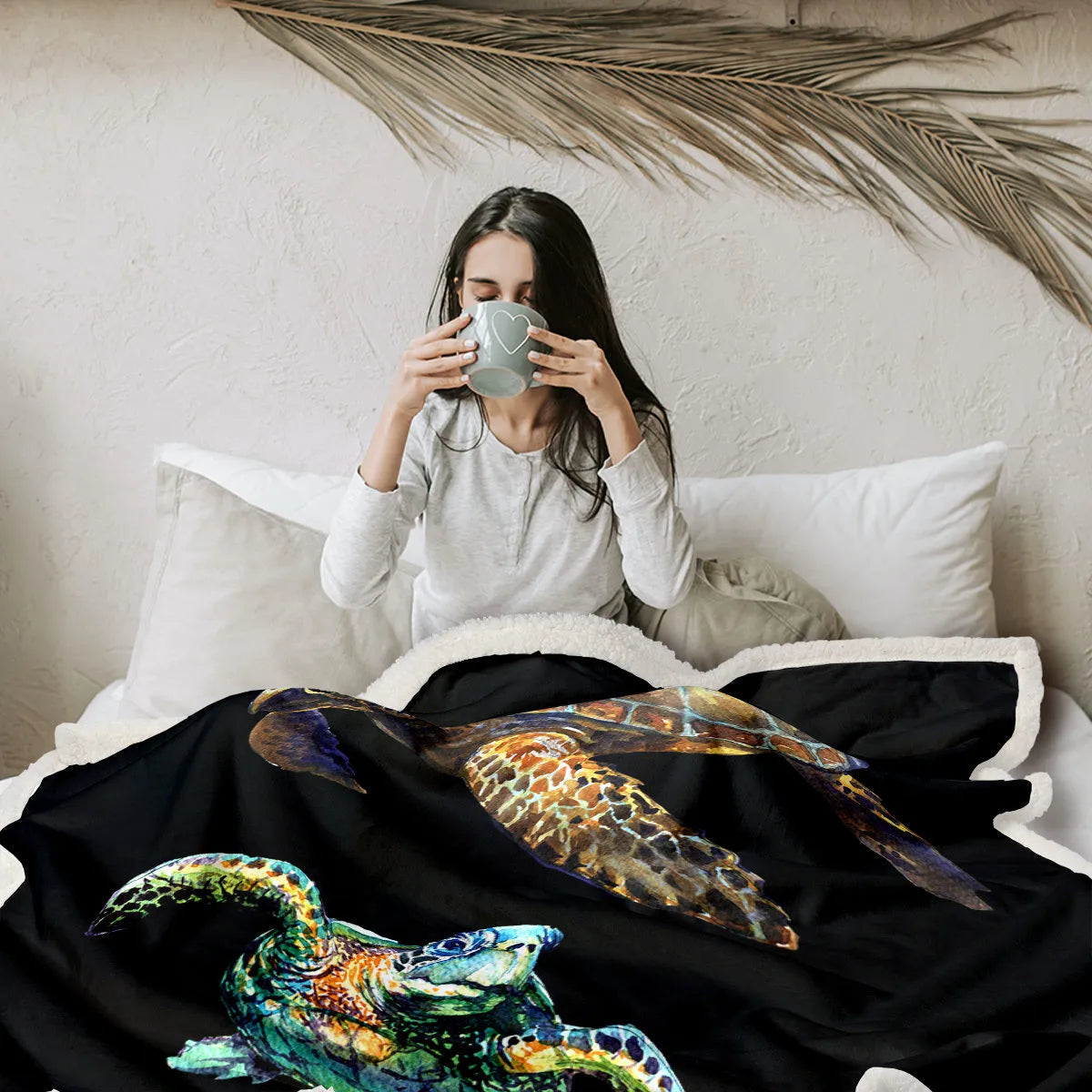 Black turtle pattern Sherpa fleece blanket on sofa, soft warm throw for home or camping