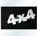 Metal 4x4 off-road rear car badge in electroplated silver finish measuring 9cm by 3.5cm