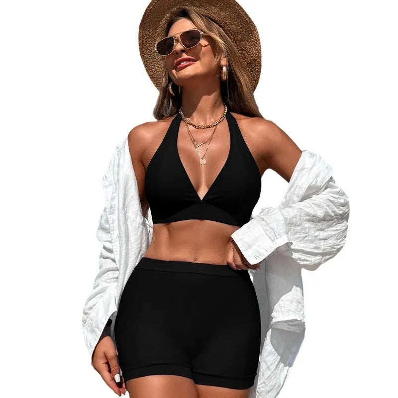 Women's black split bikini swimsuit on a mannequin, showing front and back views.