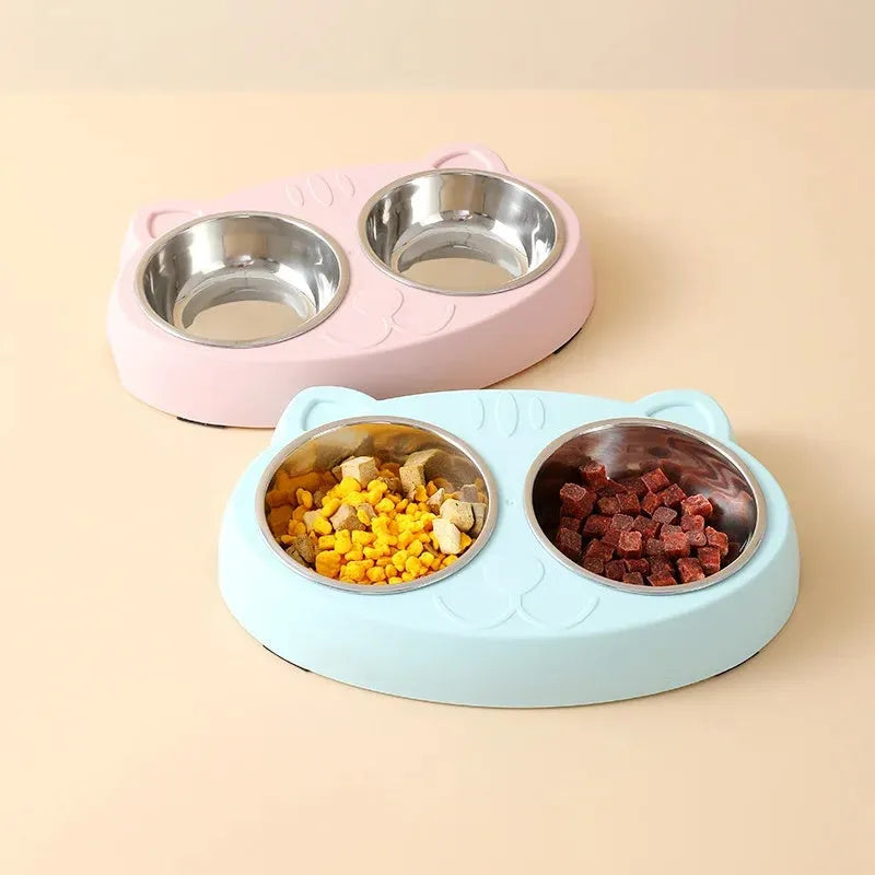 Blue plastic double-bowl pet food and water feeder tray with non-skid base.