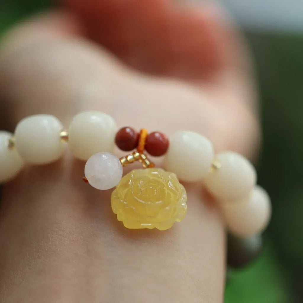 Bodhi root bracelet with gradient white jade and beeswax lotus pendants