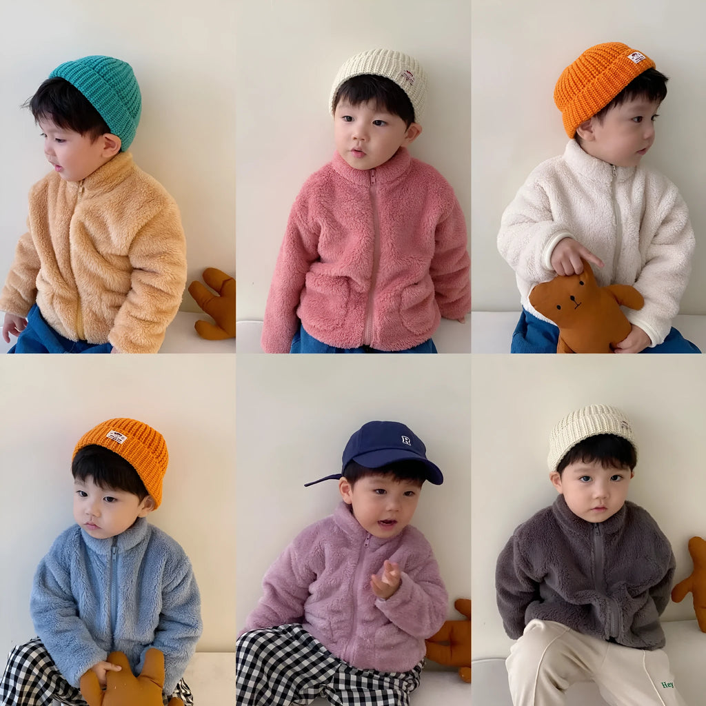 Blue children's sherpa fleece winter coat with full zip, high collar, and front pockets on a hanger.