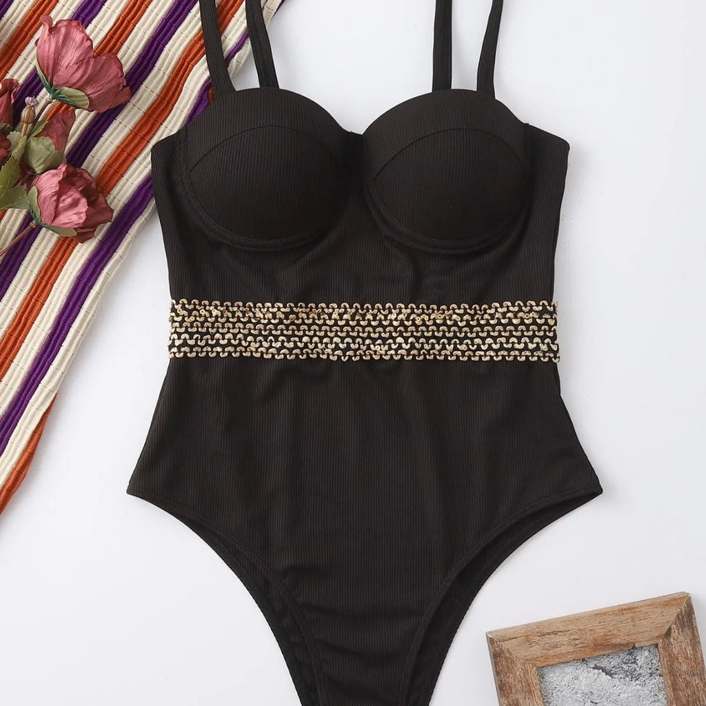 Black women's one-piece swimsuit with adjustable shoulder straps on size chart
