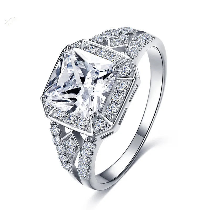 Hollow geometric zircon ring with quadrilateral detailing in platinum colour