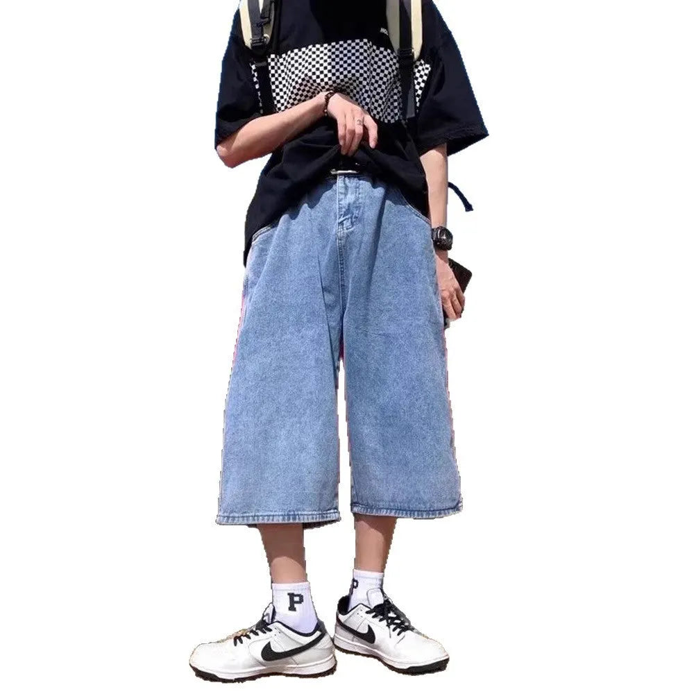 Blue washed denim men's shorts with a high waist and cropped, straight-leg pirate style.