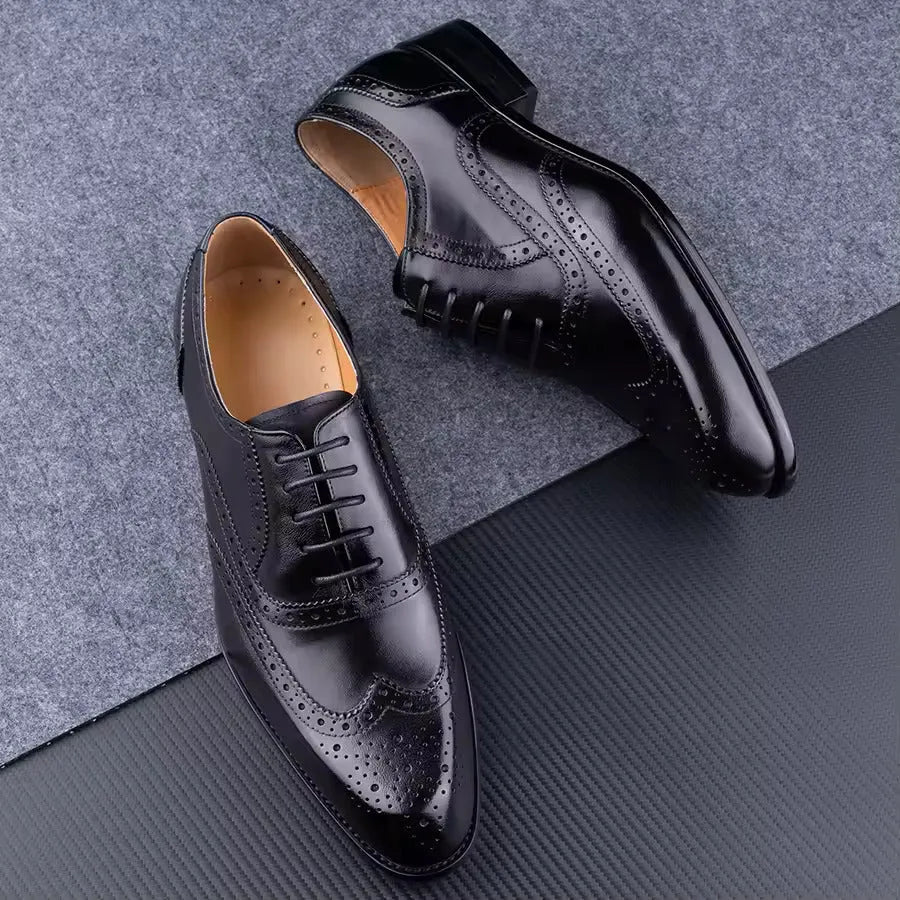 Men's purple leather Oxford dress shoes with hand-carved detail and pointed toe on a rubber sole.