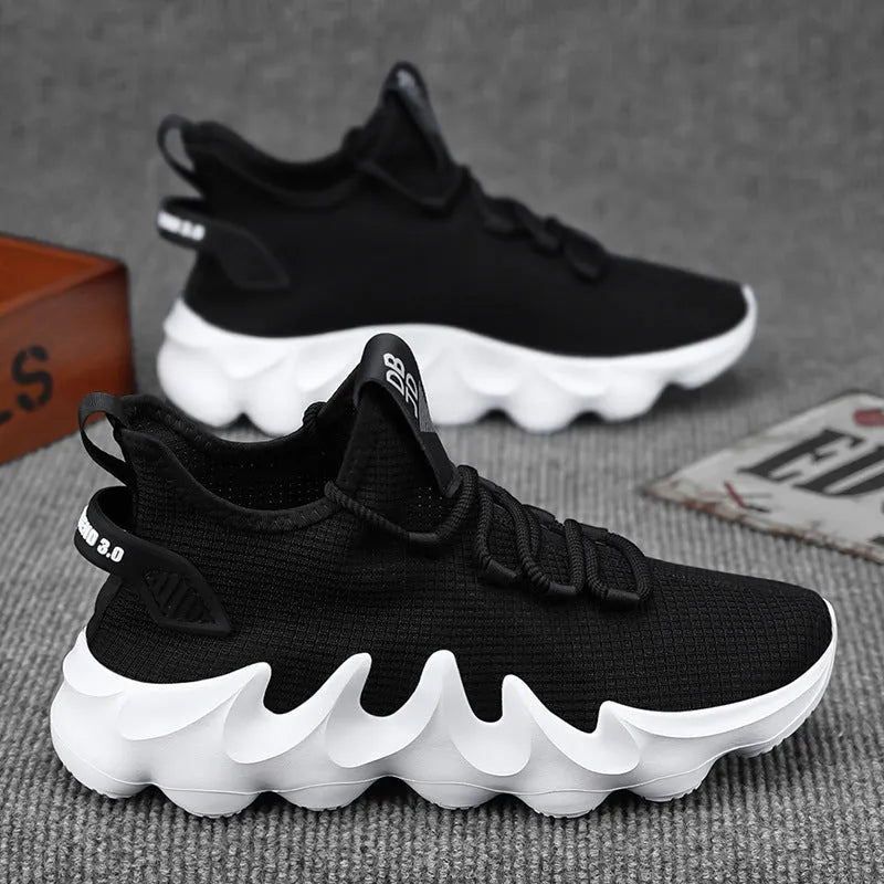 Men's black sock-like casual shoes with flat heel and lace-up front on a wear-resistant sole.