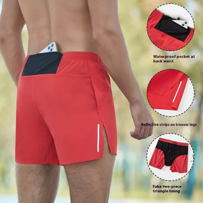 Man wearing red high-waisted loose-fit off-road running shorts during a cross-country run.