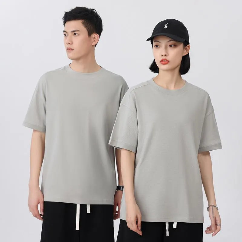 Breathable loose fit cotton short-sleeved t-shirt in a solid colour on a hanger.