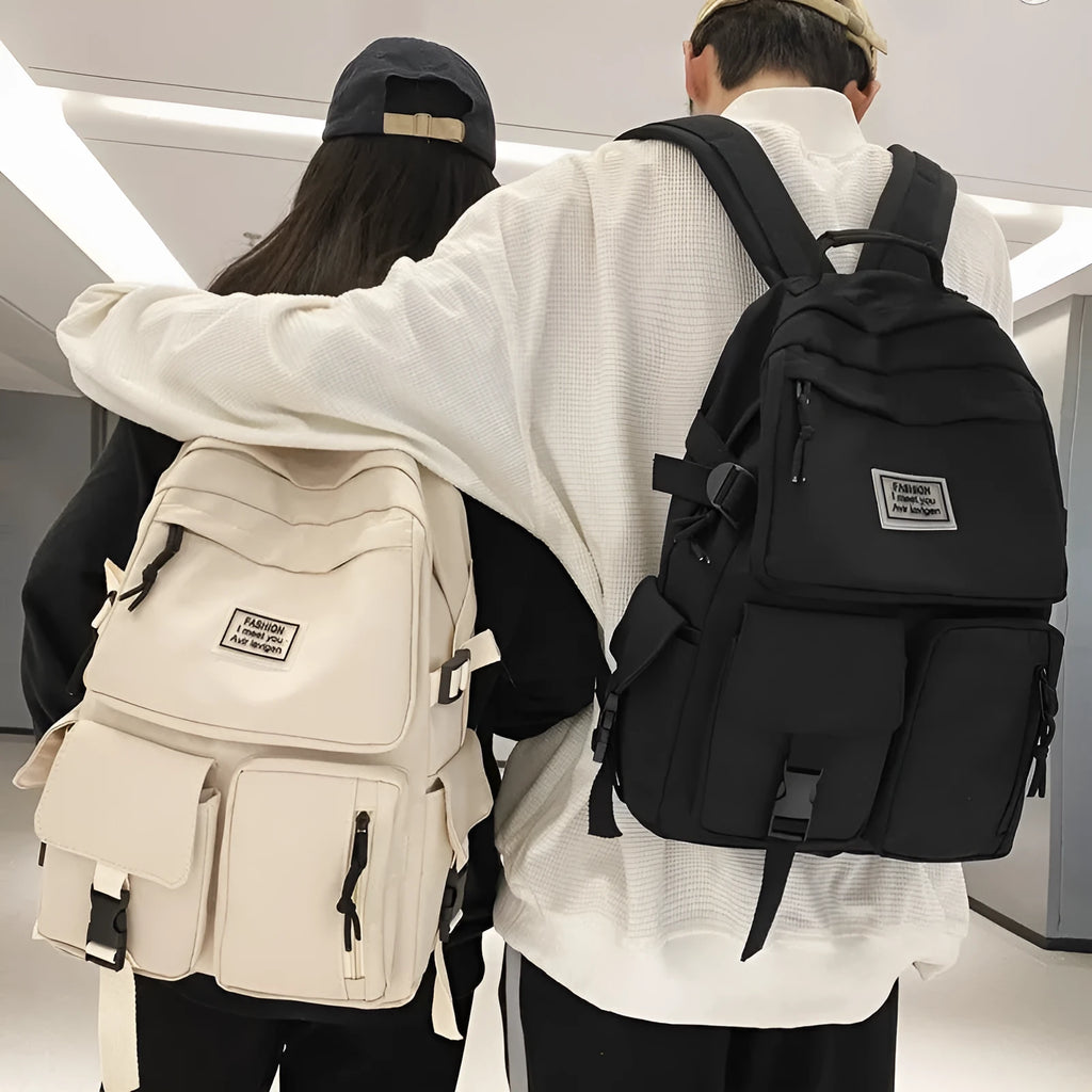 Black or white nylon student backpack with computer compartment and three-dimensional pockets