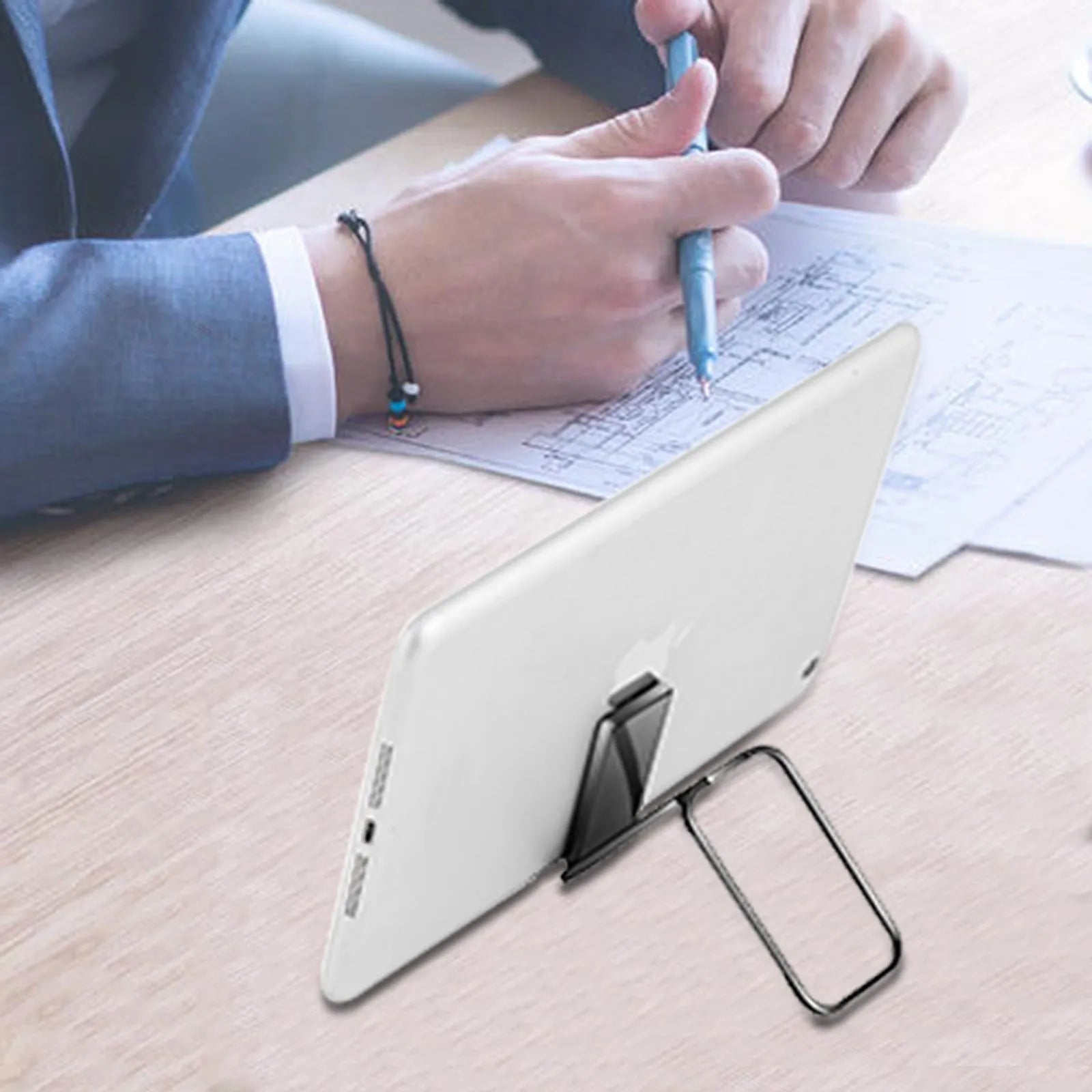 Gun black folding ring buckle phone holder attached to phone back, ring open for desktop stand