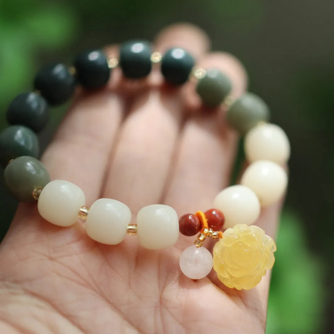 Bodhi root bracelet with gradient white jade and beeswax lotus pendants