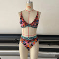 Women's floral print high waist bikini swimsuit set on a neutral background.