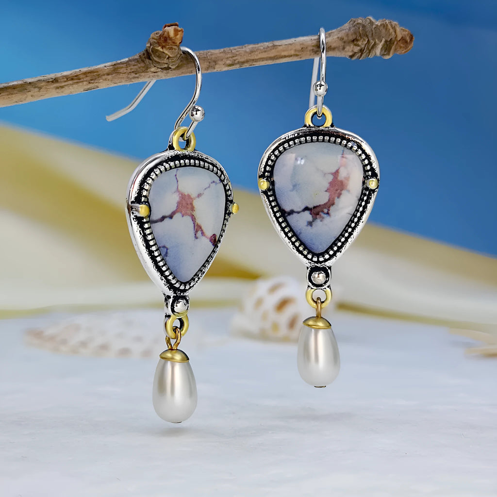 Retro blue bohemian drop earrings with synthetic opal and white pearl on metal.