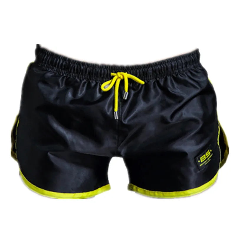 Men's solid colour polyester sports shorts in blue showing smooth beach pants design for fitness and swimming